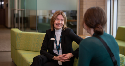 a SASCU advisor sitting with a member